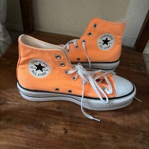 Converse women’s Orange High-Top Sneakers